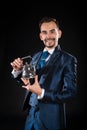 Handsome magician with a smile in a blue tailcoat Royalty Free Stock Photo