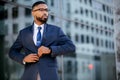 Smart intelligent successful modern african american business man in stylish suit and glasses, lifestyle candid portrait
