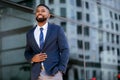 Candid lifestyle photo of a handsome african american businessman in a suit, attractive, multiethnic, mixed ethnicity model Royalty Free Stock Photo