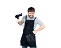 Handsome Male barber holding a hairdryer and posing for the camera. isolated on white background Royalty Free Stock Photo