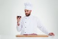 Handsome male chef cook degusting wine Royalty Free Stock Photo