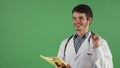 Handsome male doctor having an idea while examining documents Royalty Free Stock Photo