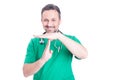 Handsome male doctor making time out gesture Royalty Free Stock Photo