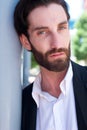 Handsome male fashion model with beard posing outdoors Royalty Free Stock Photo