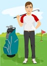 Handsome male golfer with a golf club