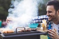 Handsome male grilling meat outdoor Royalty Free Stock Photo