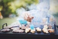 Handsome male grilling meat outdoor Royalty Free Stock Photo