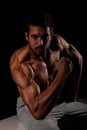 Handsome male model posing and showing his arm muscles Royalty Free Stock Photo