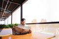 Handsome male person reading newspaper and wondering. Royalty Free Stock Photo