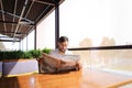 Handsome male person reading newspaper and wondering. Royalty Free Stock Photo