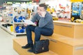 Handsome male shopkeeper keeping accountancy books Royalty Free Stock Photo