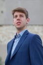 Handsome male teenager in blue suit