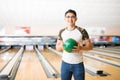 Teenager With Green Bowling Ball At Alley Royalty Free Stock Photo