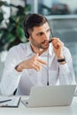 Handsome male translator working online with Royalty Free Stock Photo