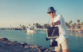 handsome man with action camera take a selfie photo in the tropical sea bay Royalty Free Stock Photo