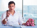 Handsome man alone in restaraunt on date Royalty Free Stock Photo