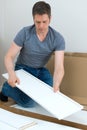 Handsome man assembling furniture. Royalty Free Stock Photo