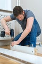 Handsome man assembling furniture. Royalty Free Stock Photo