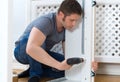 Handsome man assembling furniture. Royalty Free Stock Photo