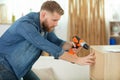 handsome man assembling furniture at home Royalty Free Stock Photo