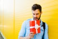 Handsome man with backpack on yellow Royalty Free Stock Photo