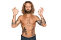 Handsome man with beard and long hair standing shirtless showing tattoos relaxed and smiling with eyes closed doing meditation Royalty Free Stock Photo