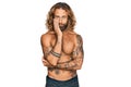 Handsome man with beard and long hair standing shirtless showing tattoos thinking looking tired and bored with depression problems Royalty Free Stock Photo