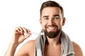 Handsome man with beautiful smile holding toothbrush on white background Royalty Free Stock Photo