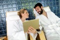 Handsome man and beautiful woman relaxing in spa Royalty Free Stock Photo