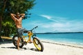 Handsome Man With Bike Sun Tanning On Beach. Summer Vacation. Royalty Free Stock Photo