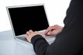 Handsome man in black hoodie using laptop Royalty Free Stock Photo