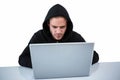 Handsome man in black hoodie using laptop Royalty Free Stock Photo
