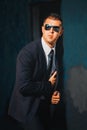 Handsome man in black suit and sunglasses. Secret agent, mafia, bodyguard concept Royalty Free Stock Photo