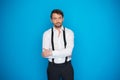 Handsome man on blue wearing white shirt and braces Royalty Free Stock Photo