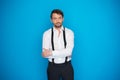 Handsome man on blue wearing white shirt and braces Royalty Free Stock Photo