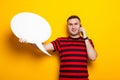 Handsome man in bright T-shirt with speech bubble Royalty Free Stock Photo