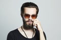 Handsome man. Brutal bearded boy in trendy sunglasses Royalty Free Stock Photo