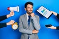 Handsome man business with beard working at the office being stressed out thinking concentrated about doubt with finger on chin