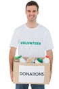 Handsome man carrying donation box with food Royalty Free Stock Photo