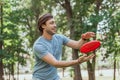 handsome man catching frisbee disk