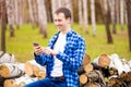 Handsome man cell phone call smile outdoor city street, Young attractive guy blue shirt use smartphone Royalty Free Stock Photo