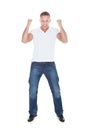 Handsome man cheering in exultation Royalty Free Stock Photo