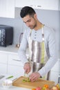 handsome man chopping vegetables at home Royalty Free Stock Photo