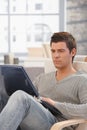 Handsome man concentrating on laptop screen Royalty Free Stock Photo