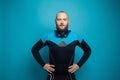 Handsome man diver on blue studio wall background Royalty Free Stock Photo