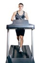 Handsome man doing cardio exercises, running on treadmills in the gym Royalty Free Stock Photo