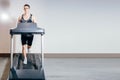 Handsome man doing cardio exercises, running on treadmills in the gym Royalty Free Stock Photo