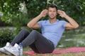 handsome man doing exercise outdoors