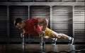 Handsome man doing push ups exercise with one hand in fitness gym Royalty Free Stock Photo