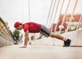 Handsome man doing push-ups outdoors on sunny day. Royalty Free Stock Photo